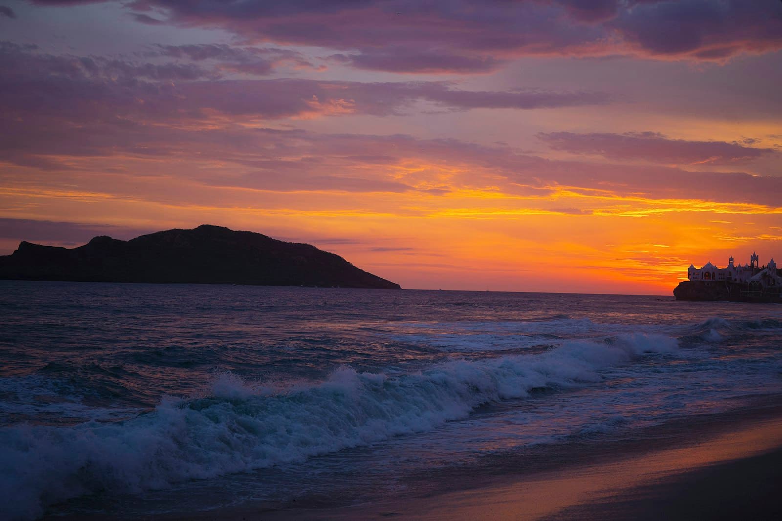Mazatlán — sea waves crashing on shore during sunset