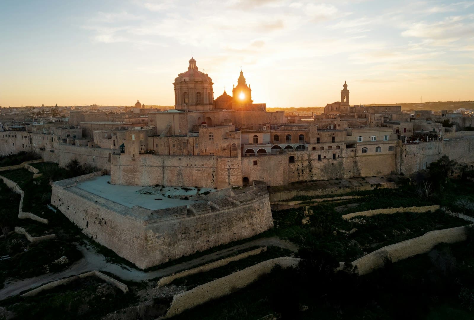 Mdina — the sun is setting over a large city