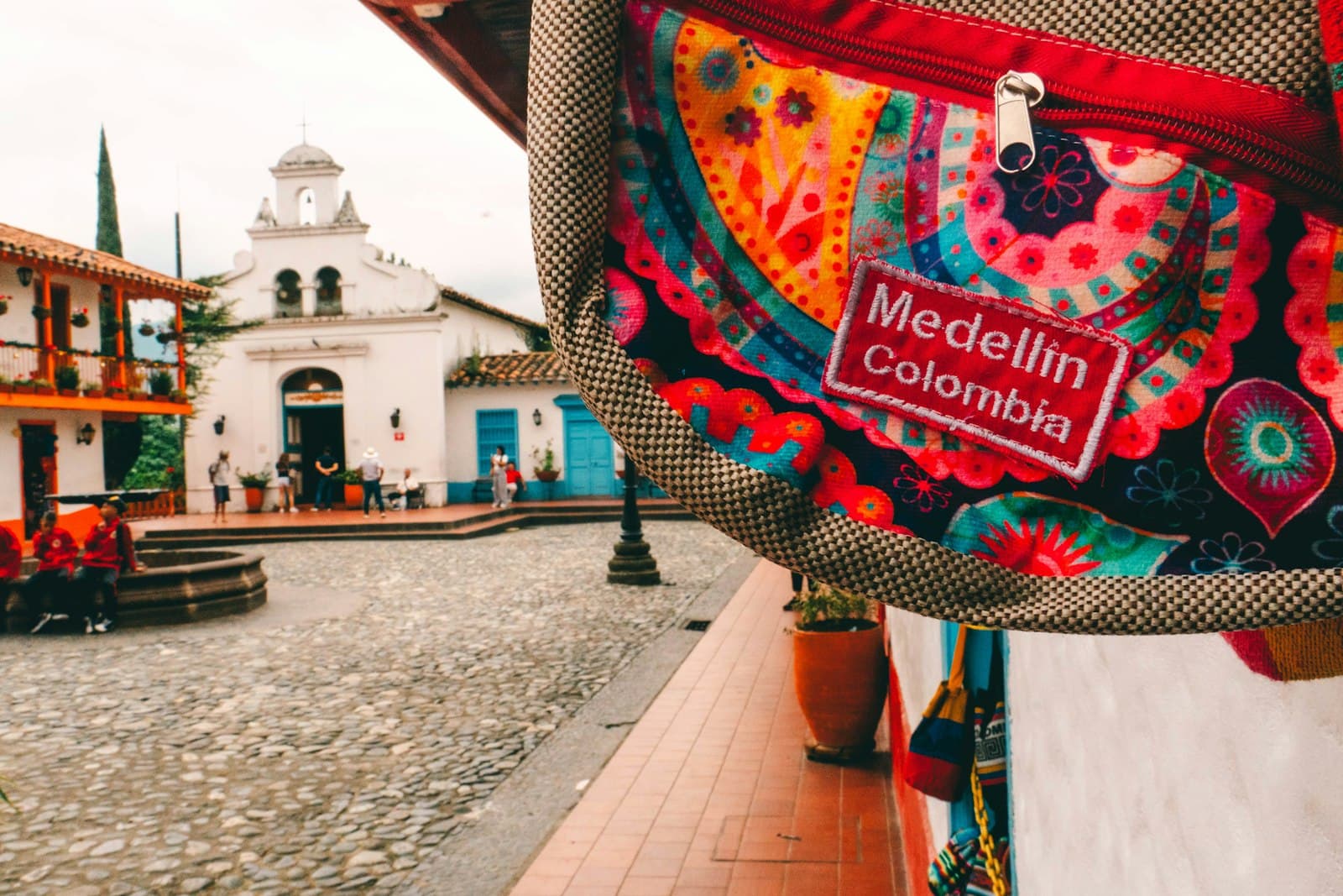 Medellín — a colorful bag hanging from the side of a building