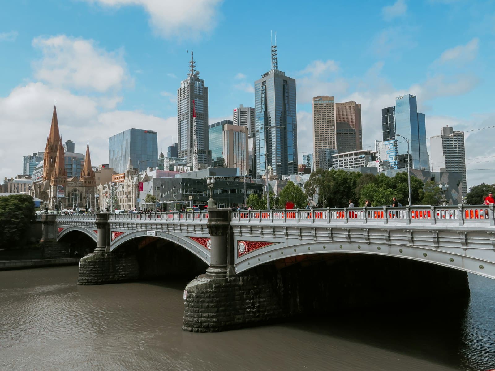 Melbourne — white bridge across city buildings