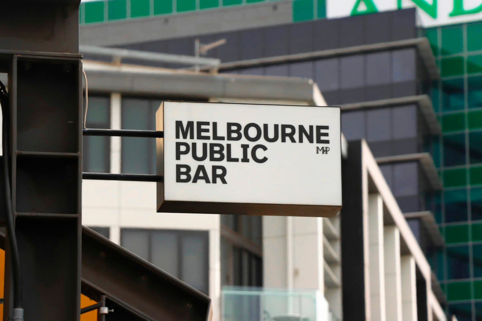 Melbourne's Laneways — white and black Melbourne Public Bar board signage