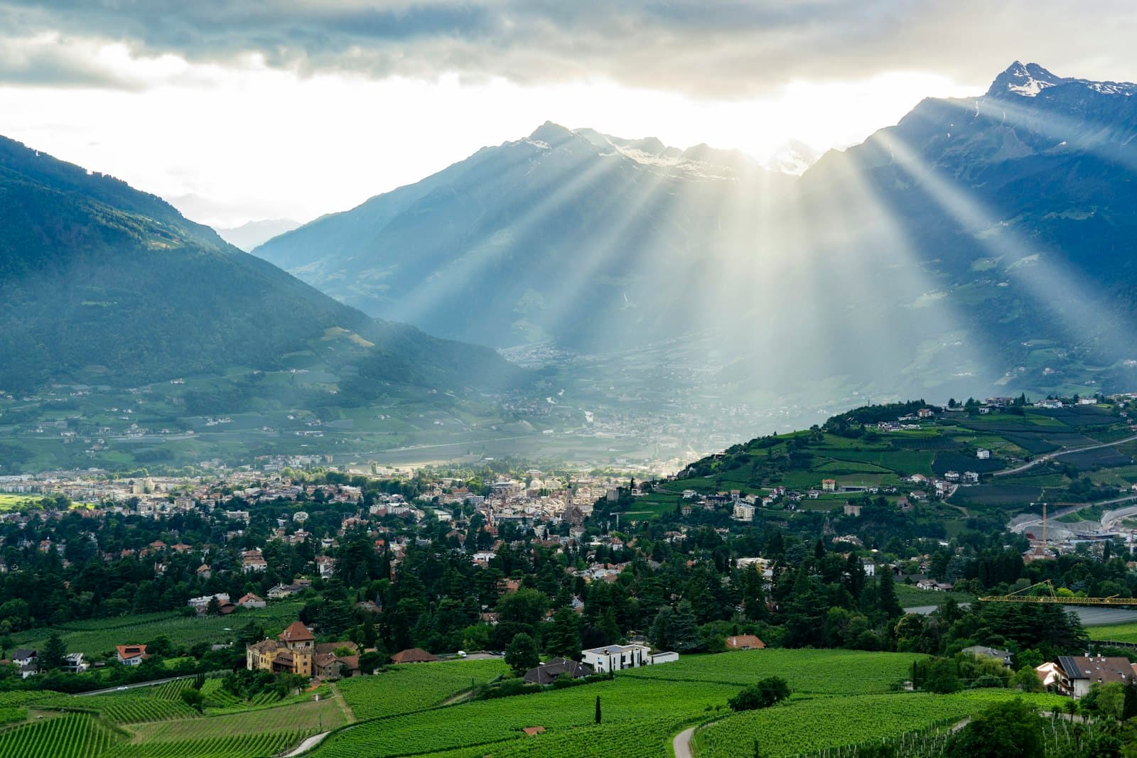 Merano — A view of a valley with mountains in the background