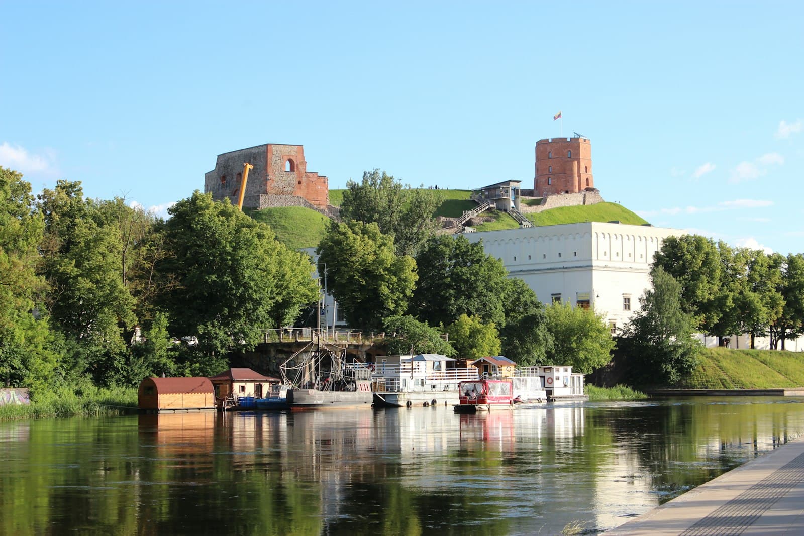 Merkinė — a body of water with boats and buildings along it
