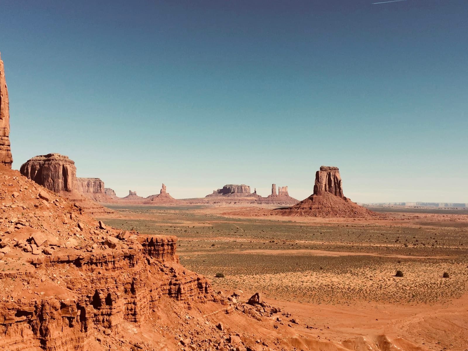 Mesa — brown rock formation under blue sky during daytime