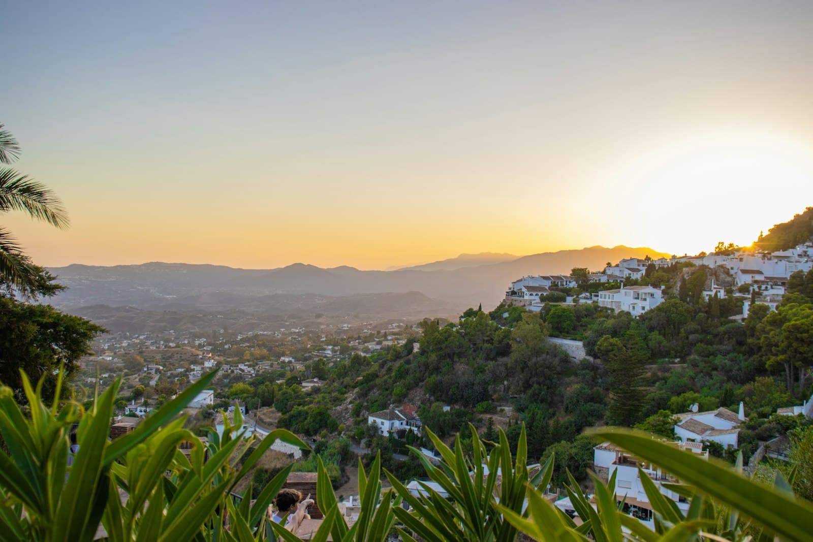 Mijas — the sun is setting over a small town