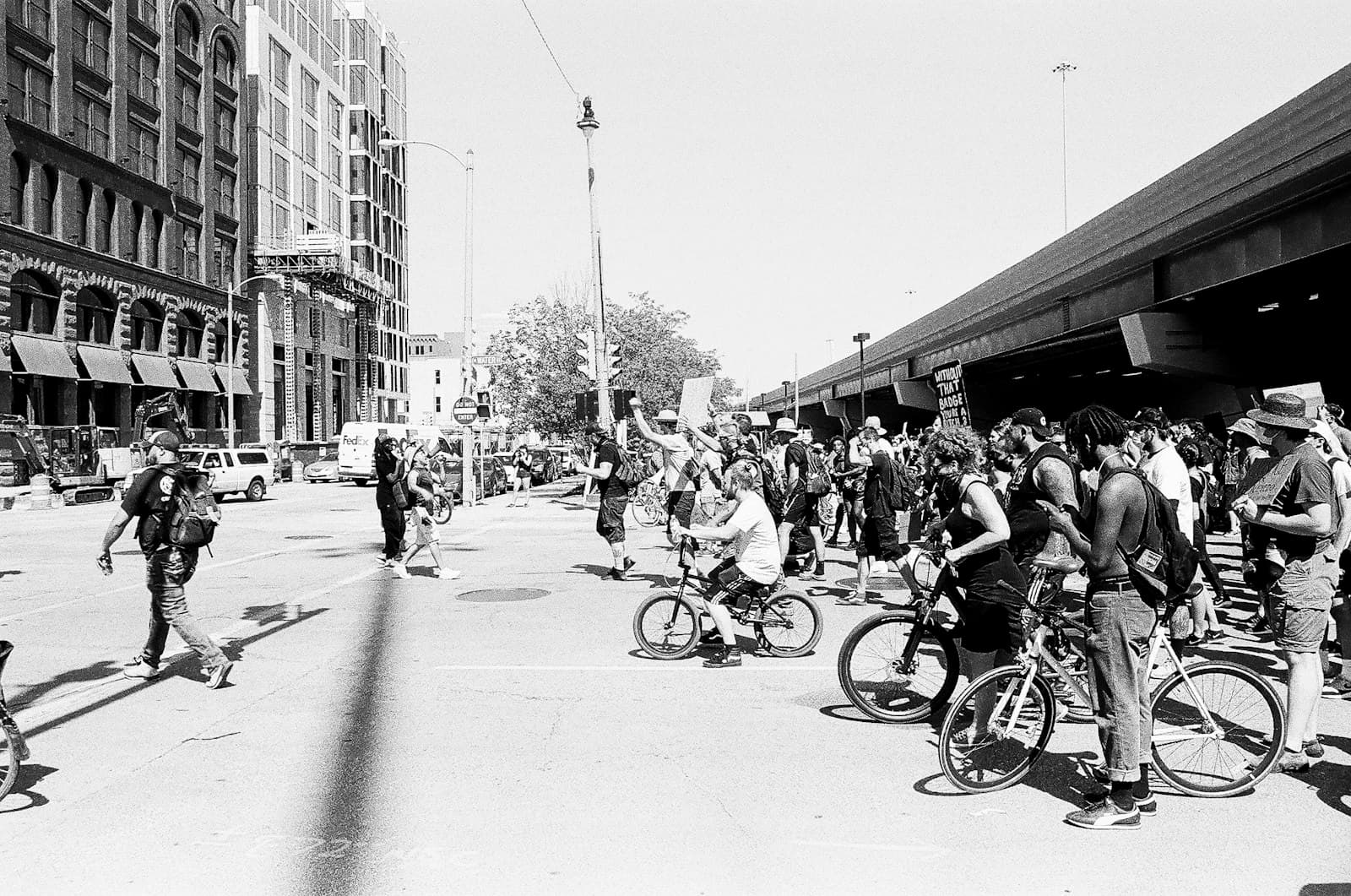 Milwaukee — people riding bicycles on street in grayscale photography