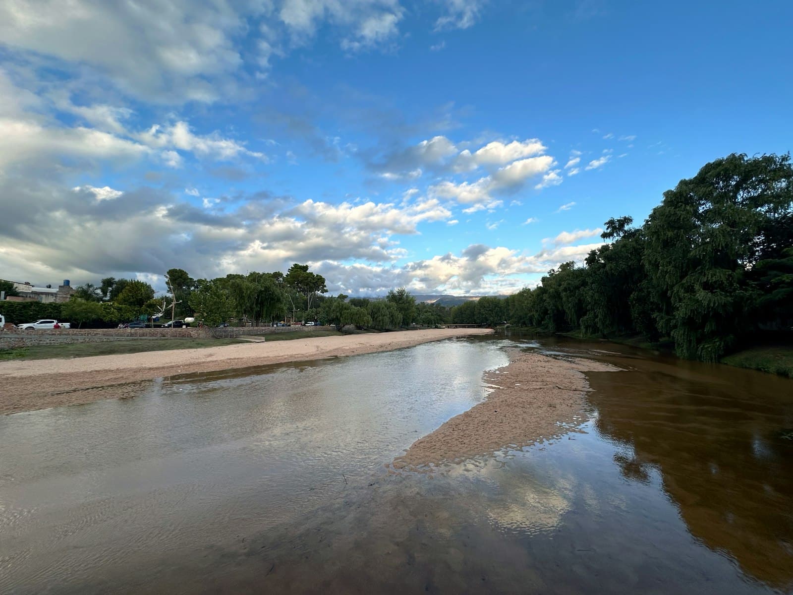 Mina Clavero — a river running through a lush green forest