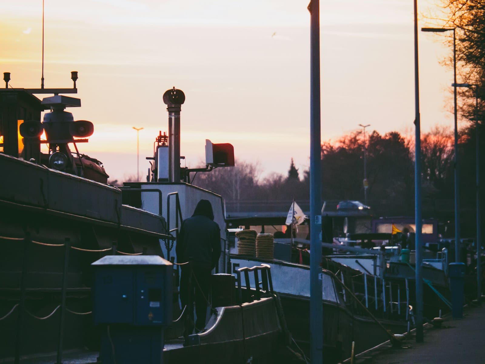 Minden — a man standing on a boat in the water