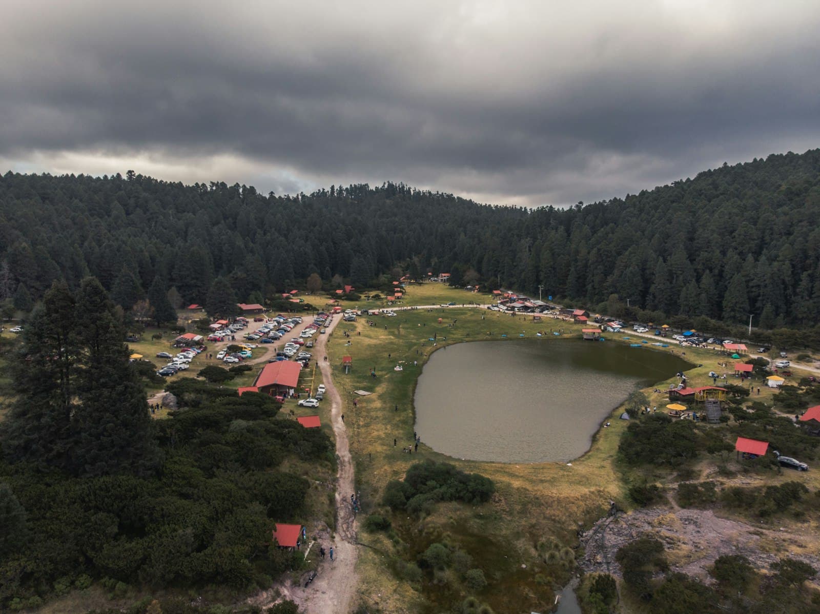 Mineral del Chico — green trees near river under cloudy sky during daytime