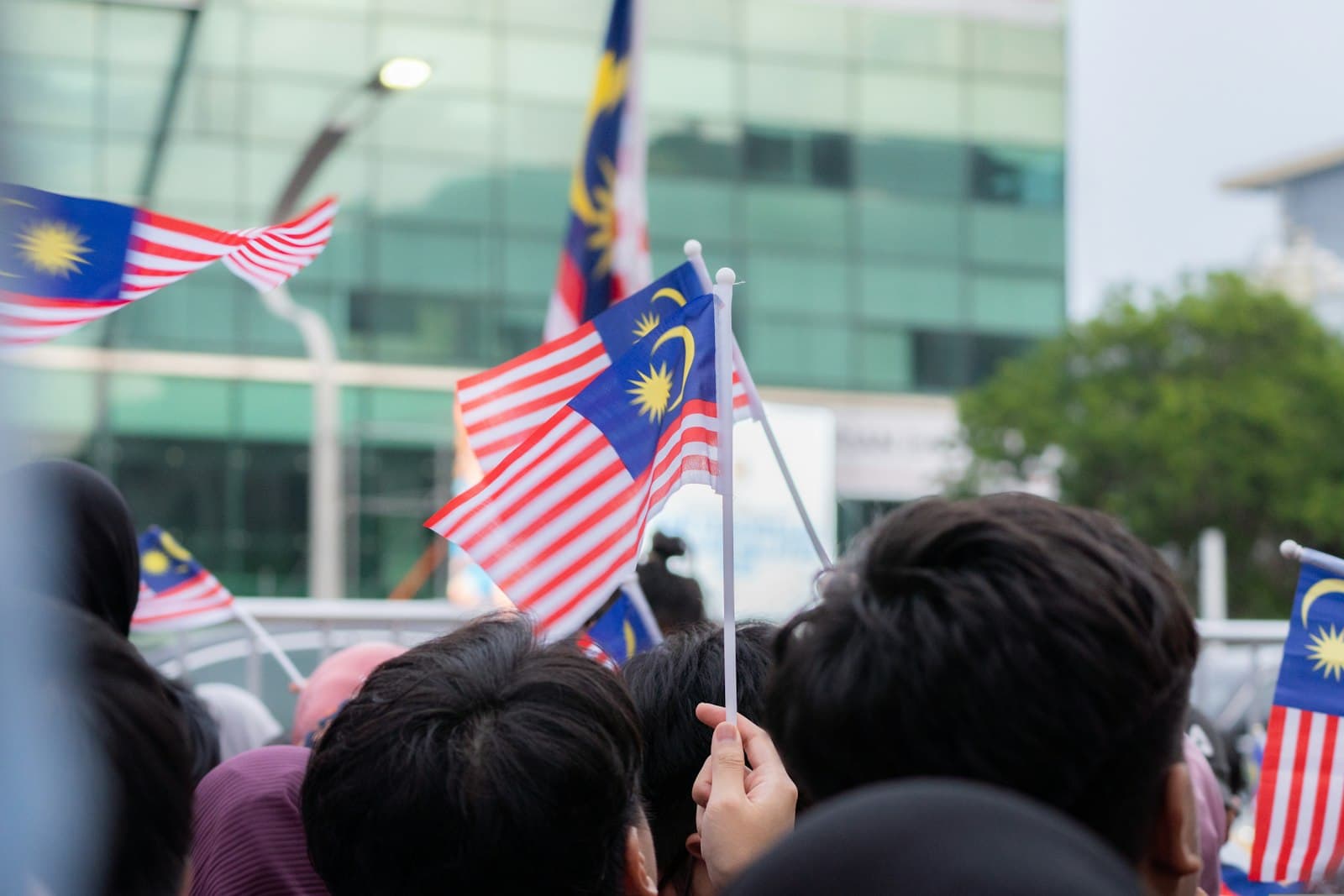 Miri — a group of people holding malaysia and malaysia flags
