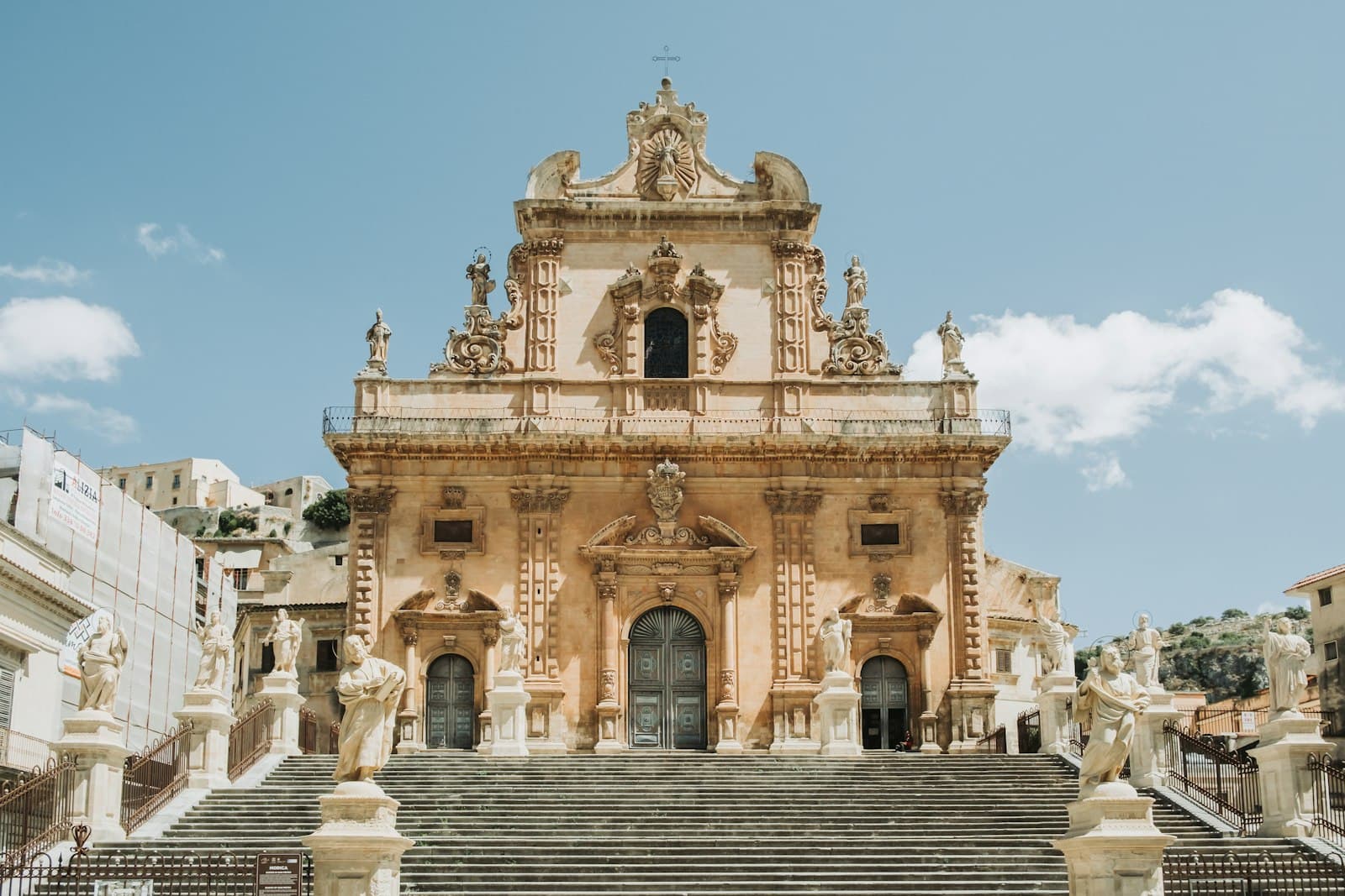Modica — a large building with stairs leading up to it