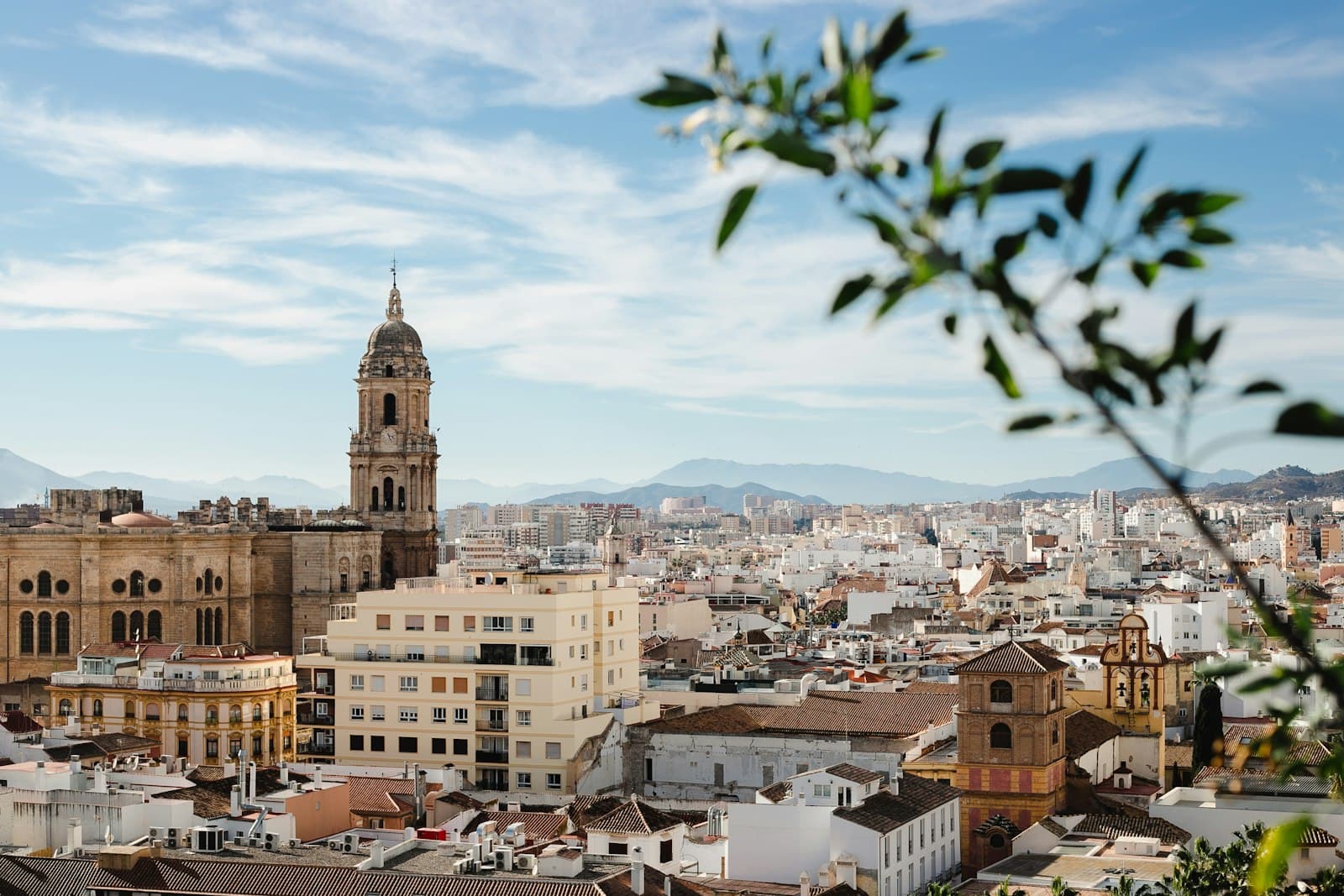 Mogarraz — a view of a city with tall buildings and a clock tower