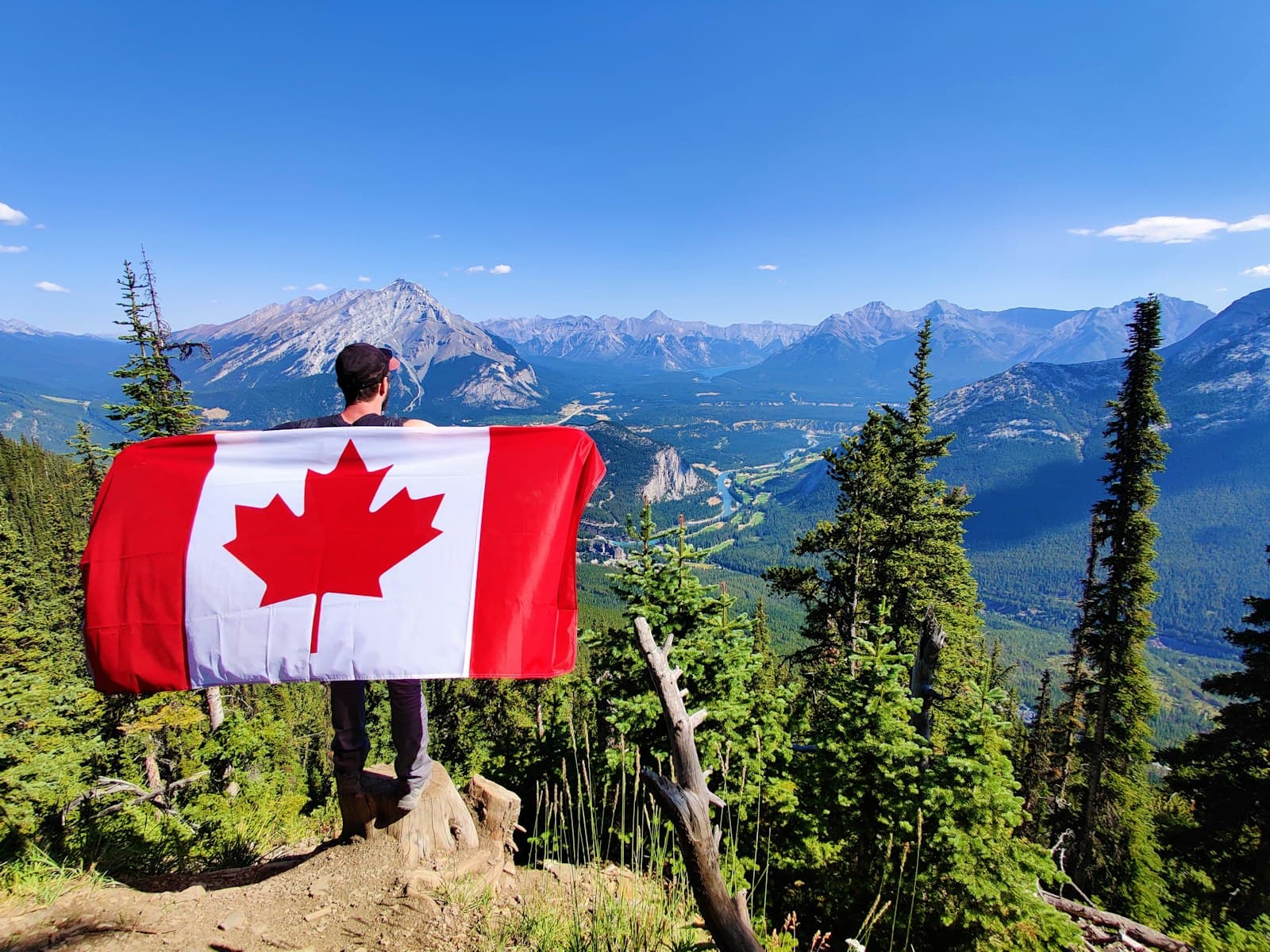 Mont-Tremblant — red and white flag on brown tree trunk