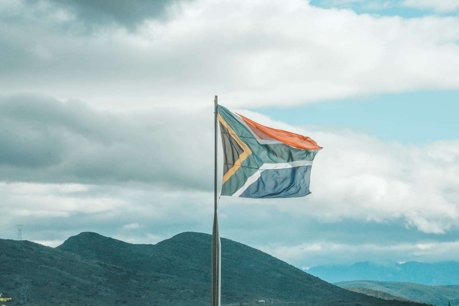 Montagu — a flag on a pole with mountains in the background