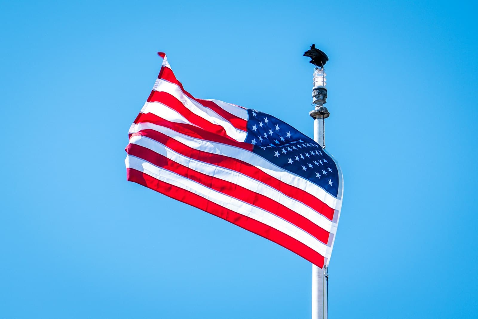 Monterey — An american flag waves against a blue sky.