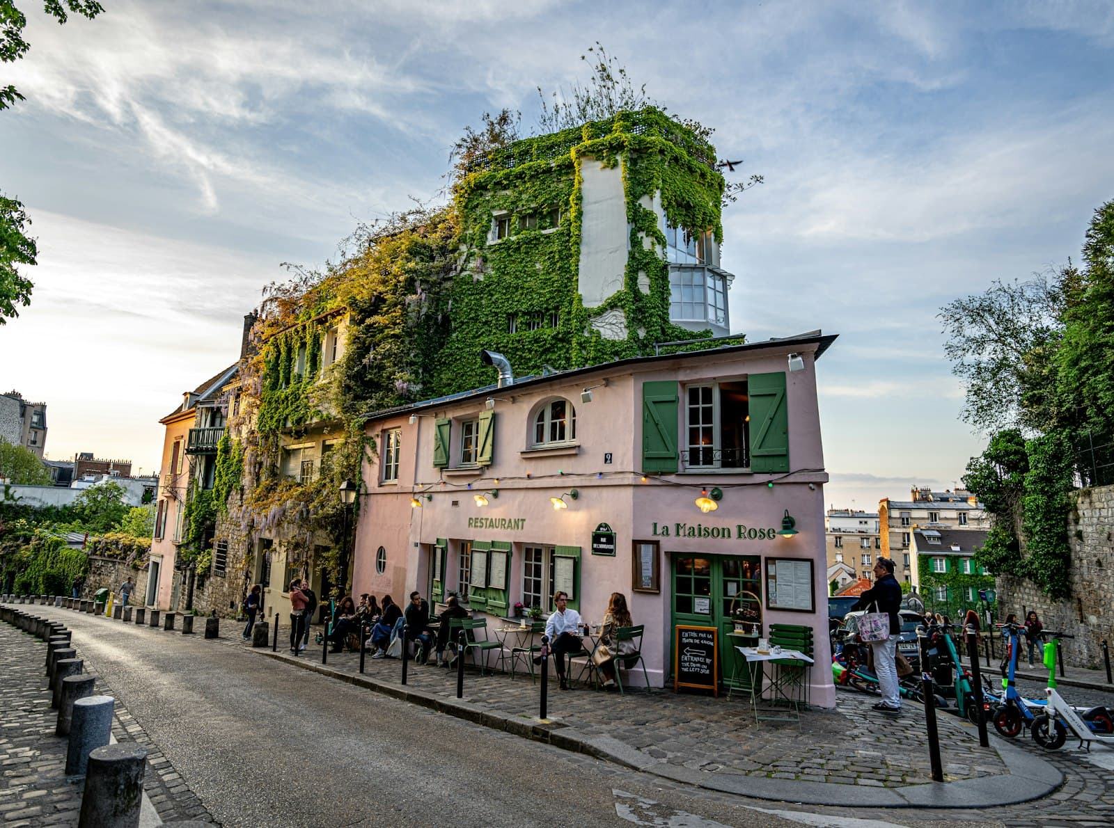 Montmartre of the Artists — a group of people walking around a building