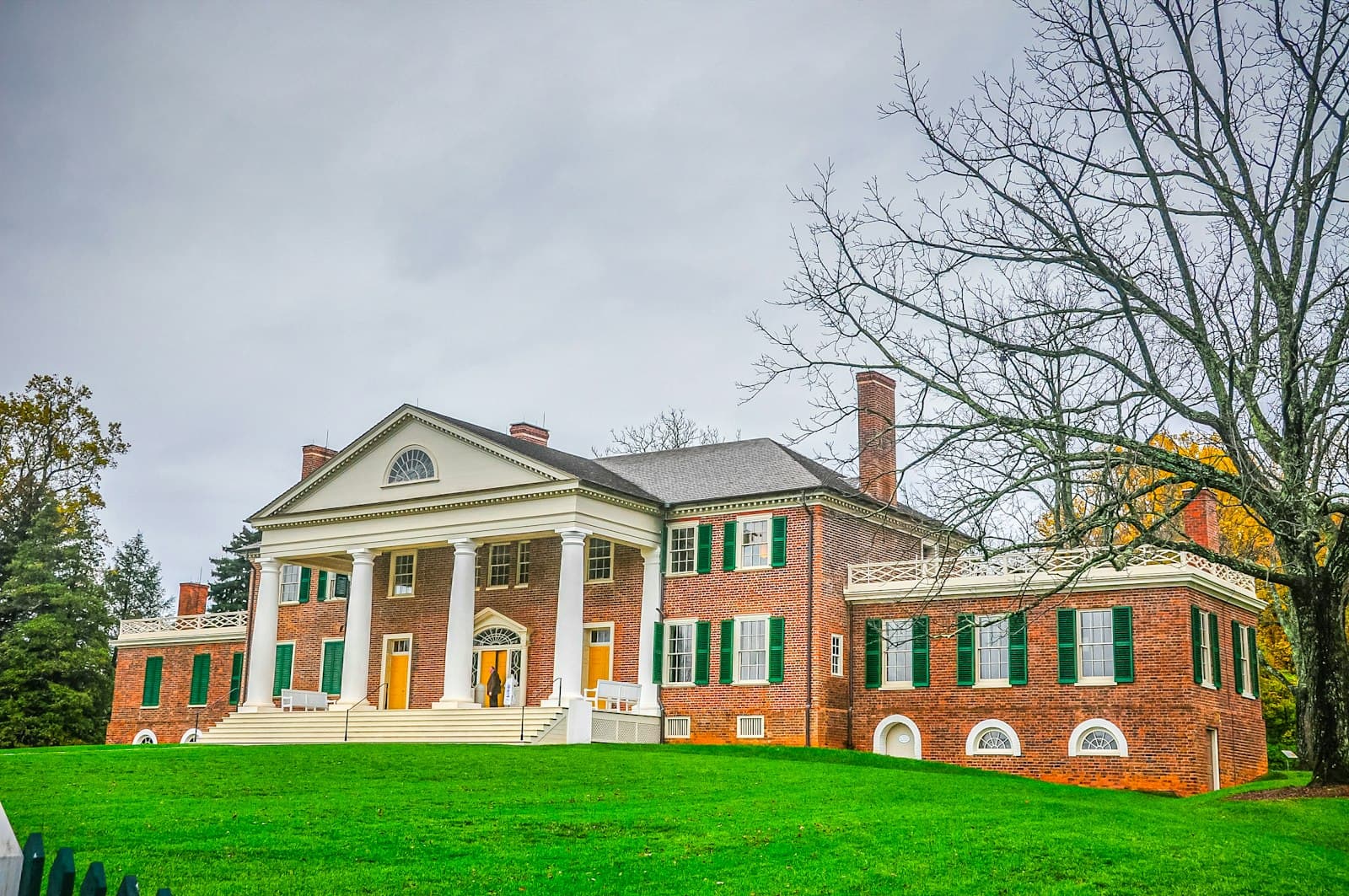 Montpelier — A large red brick house sitting on top of a lush green field
