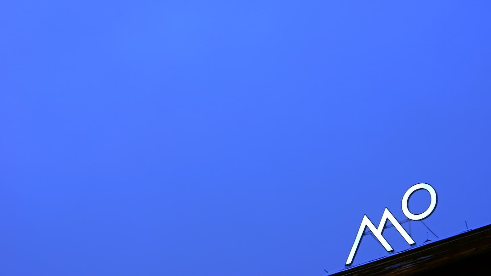 Mo'orea — a blue sky with a sign on top of it