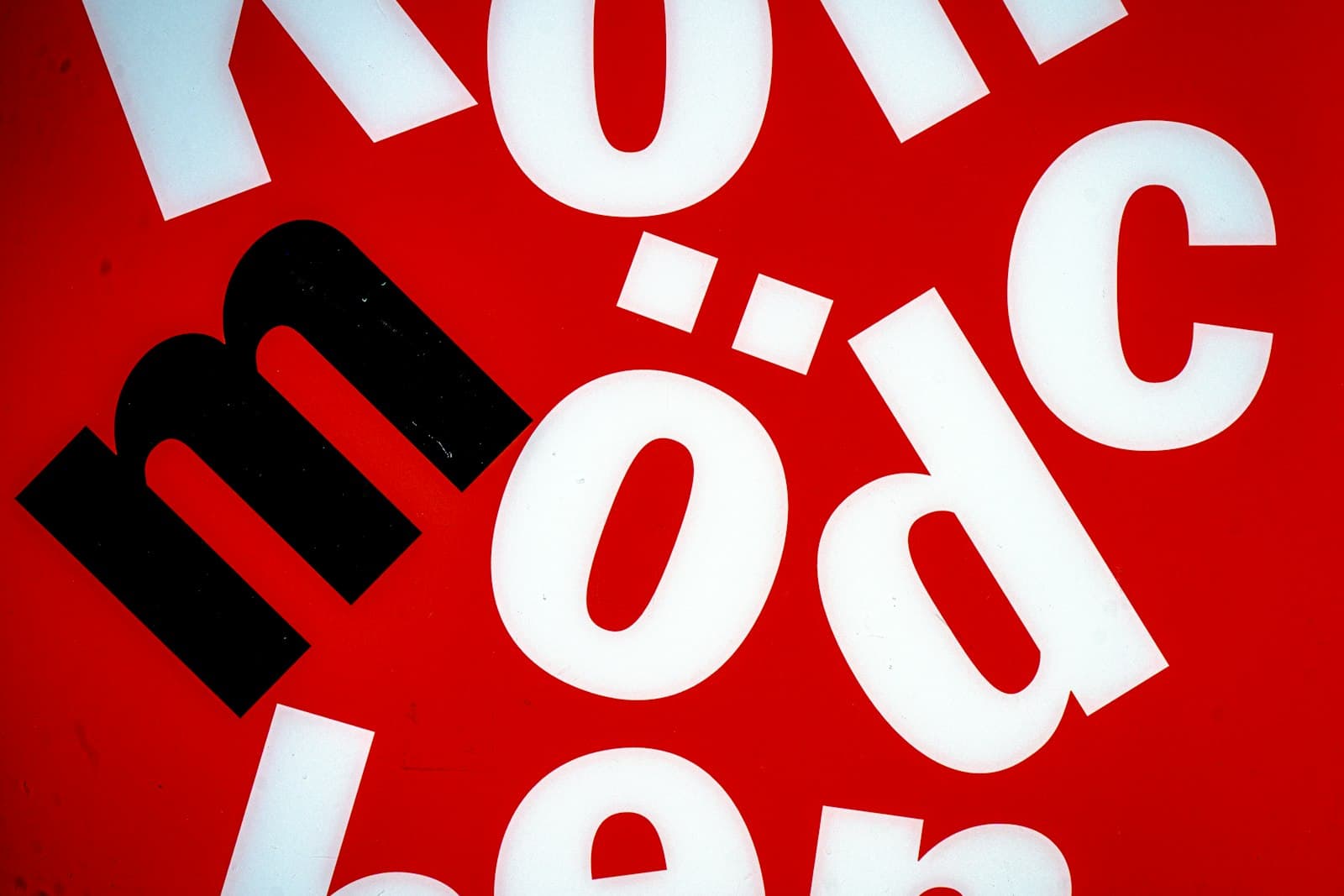 Mo'orea — White and black letters on a red background
