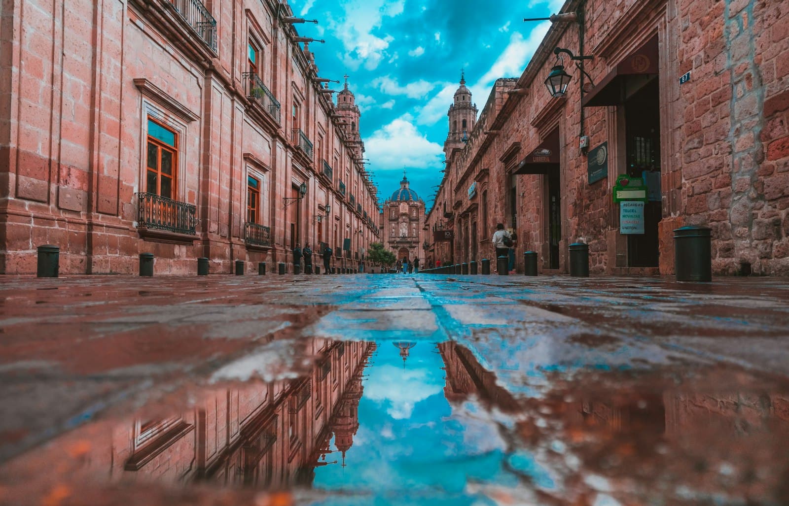 Morelia — empty alley with buildings on side under blue sky