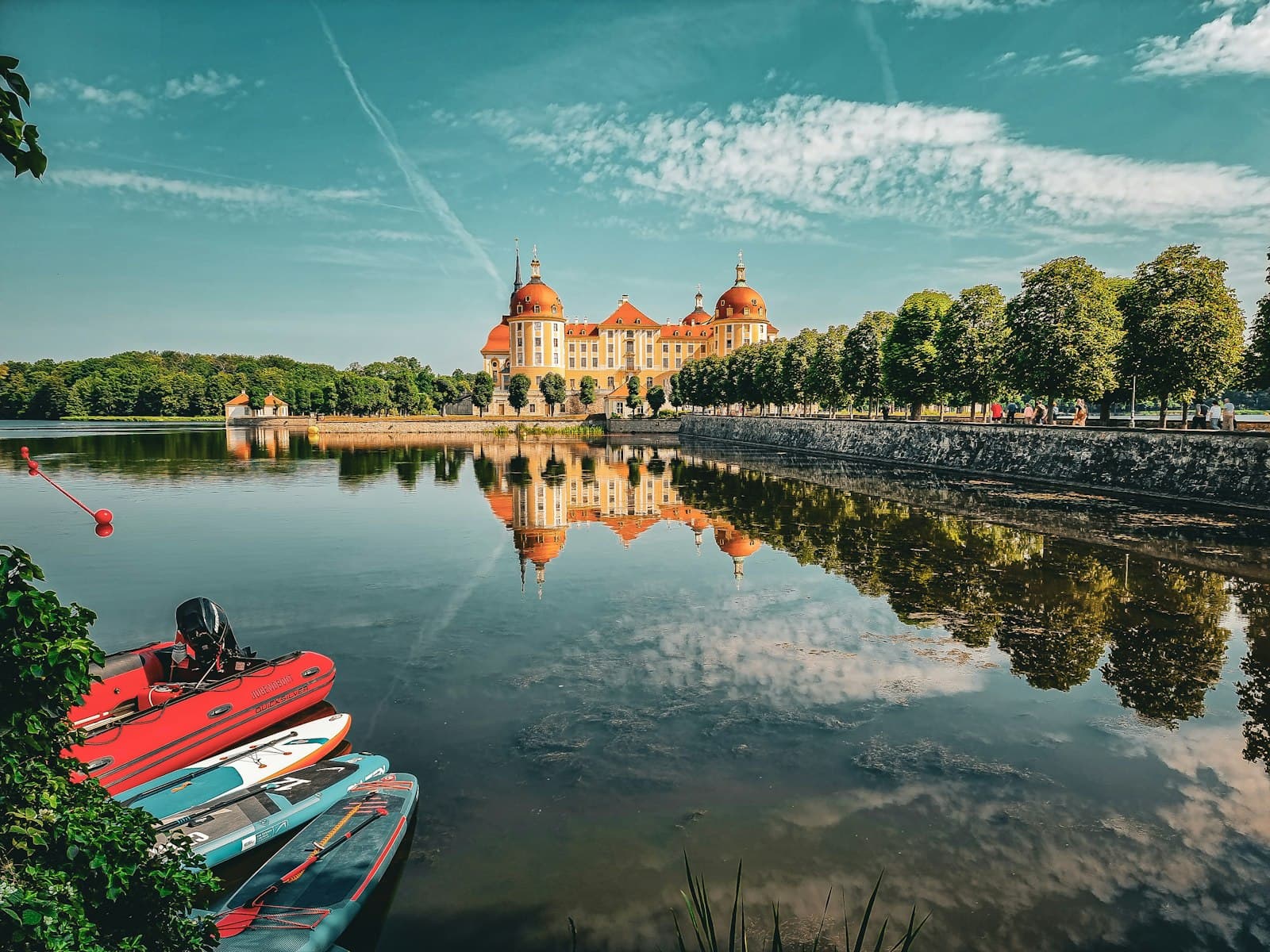 Moritzburg — a body of water surrounded by trees and a large building