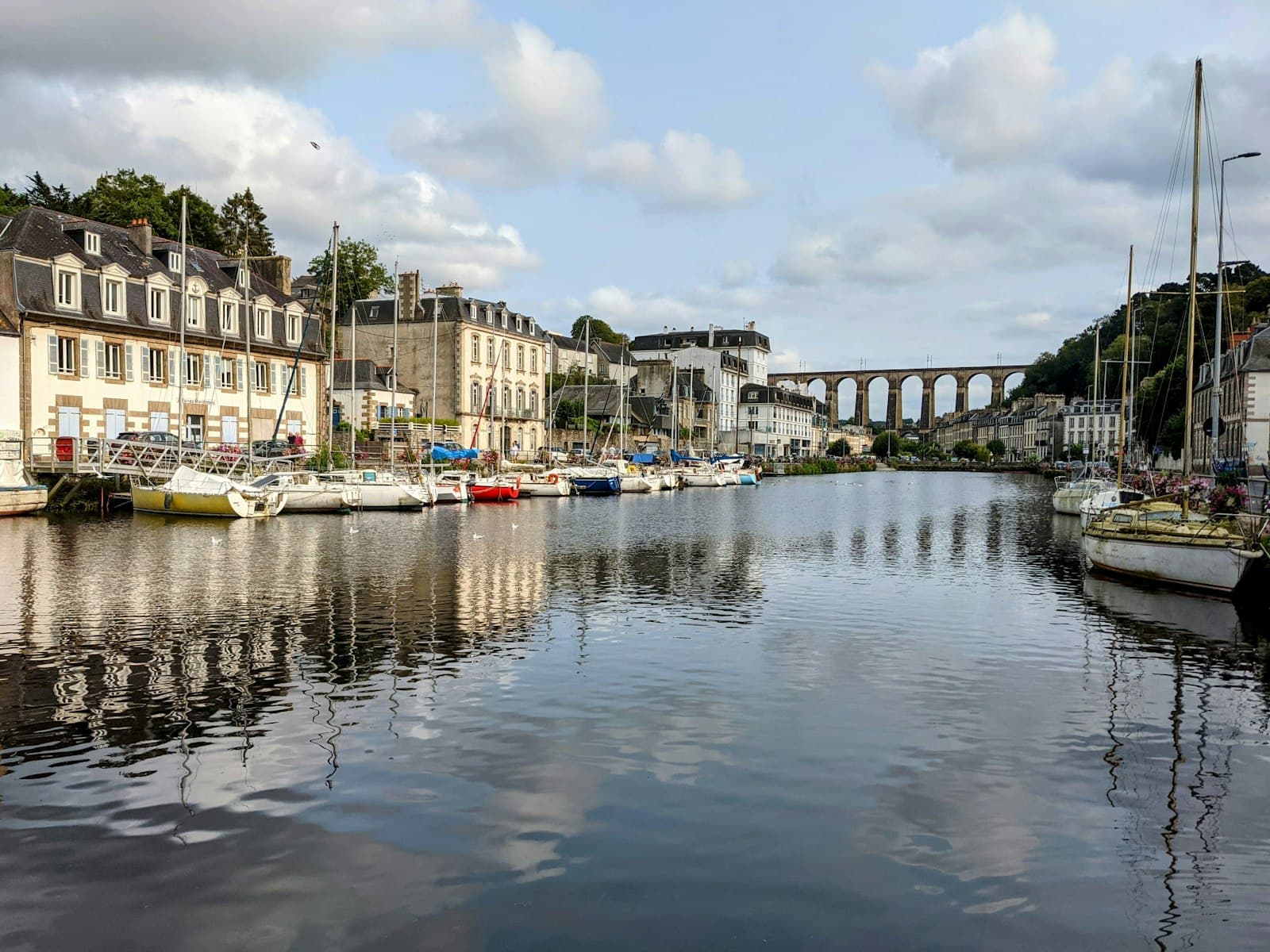 Morlaix — A body of water with a bridge in the background