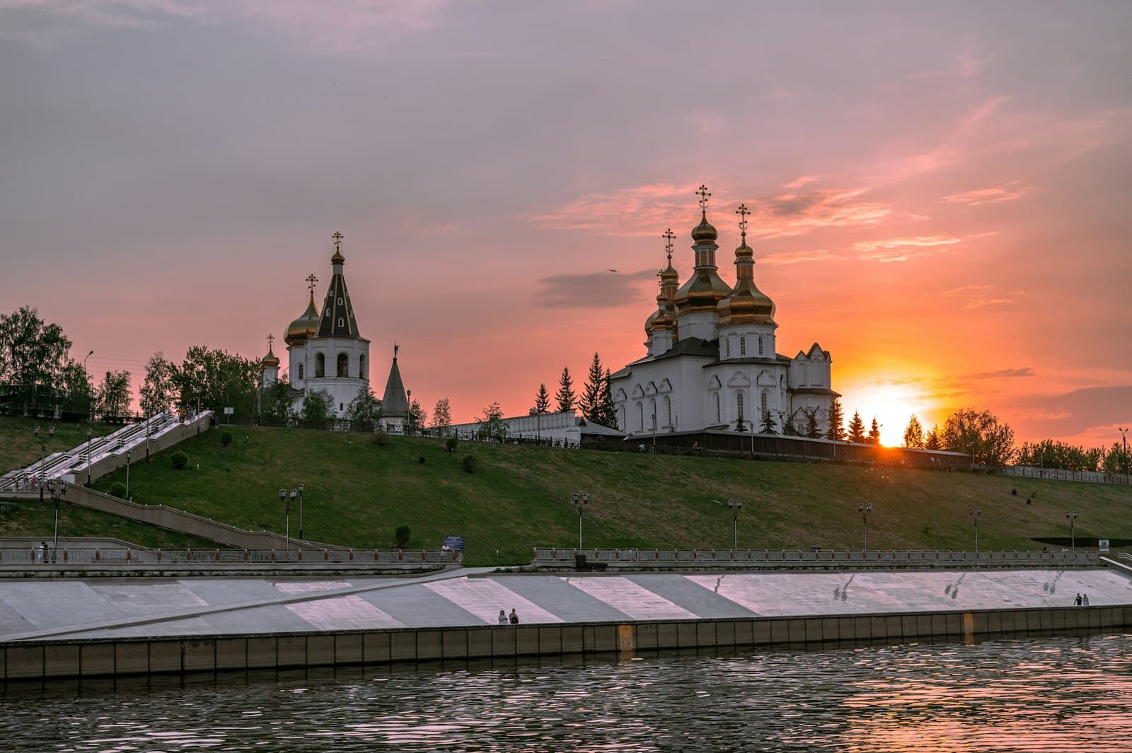 Mozhaysk — white and brown concrete building under cloudy sky during sunset