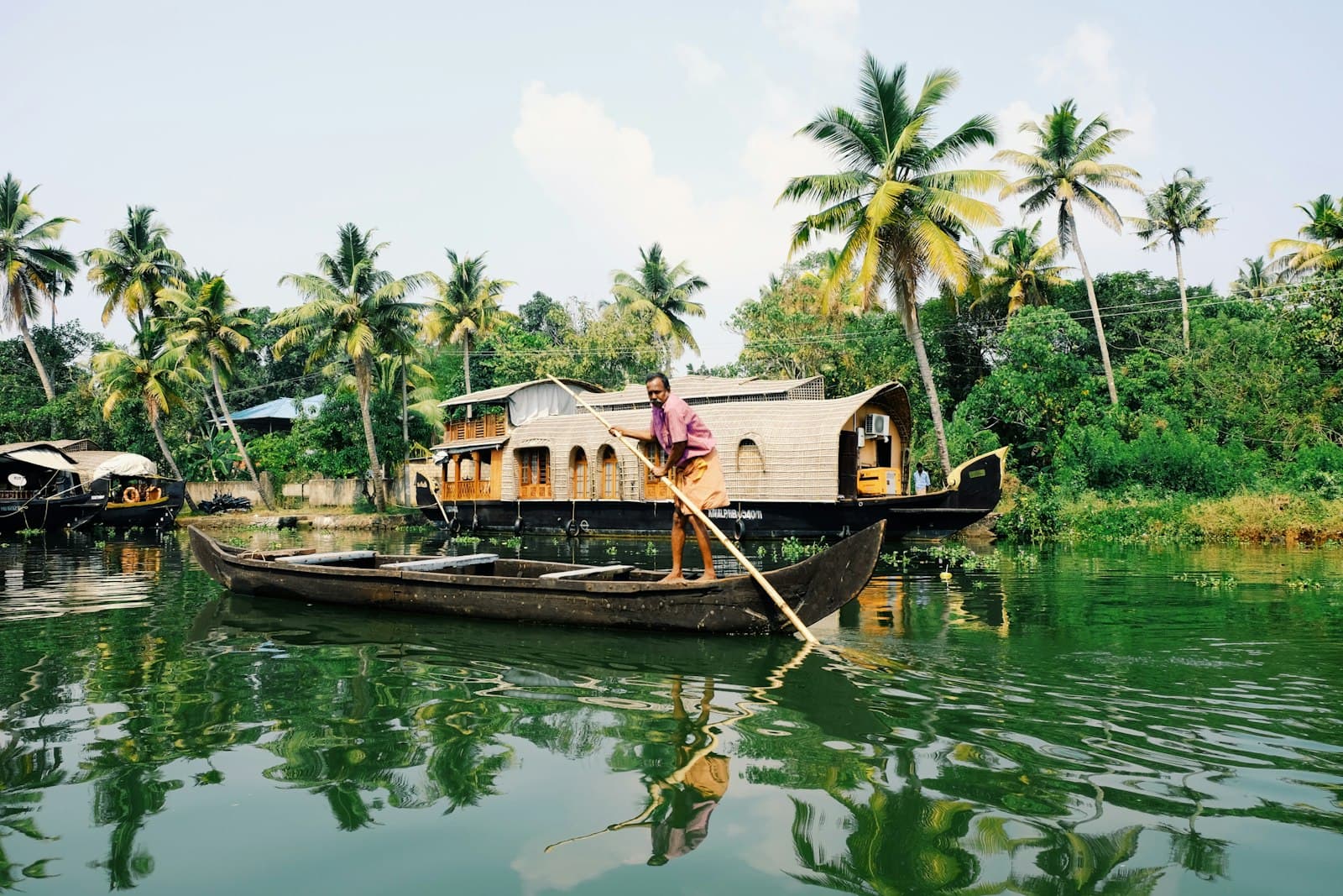 Munnar — man riding on boat during daytime