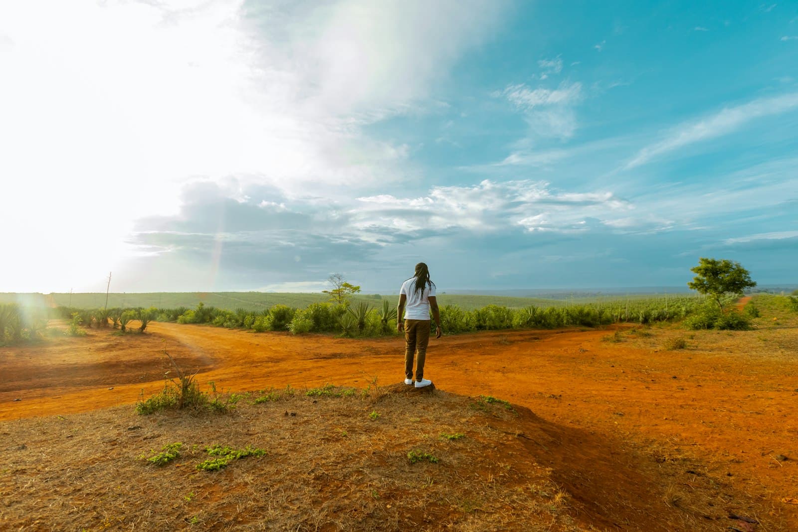 Mwanza — a woman standing on top of a dirt field