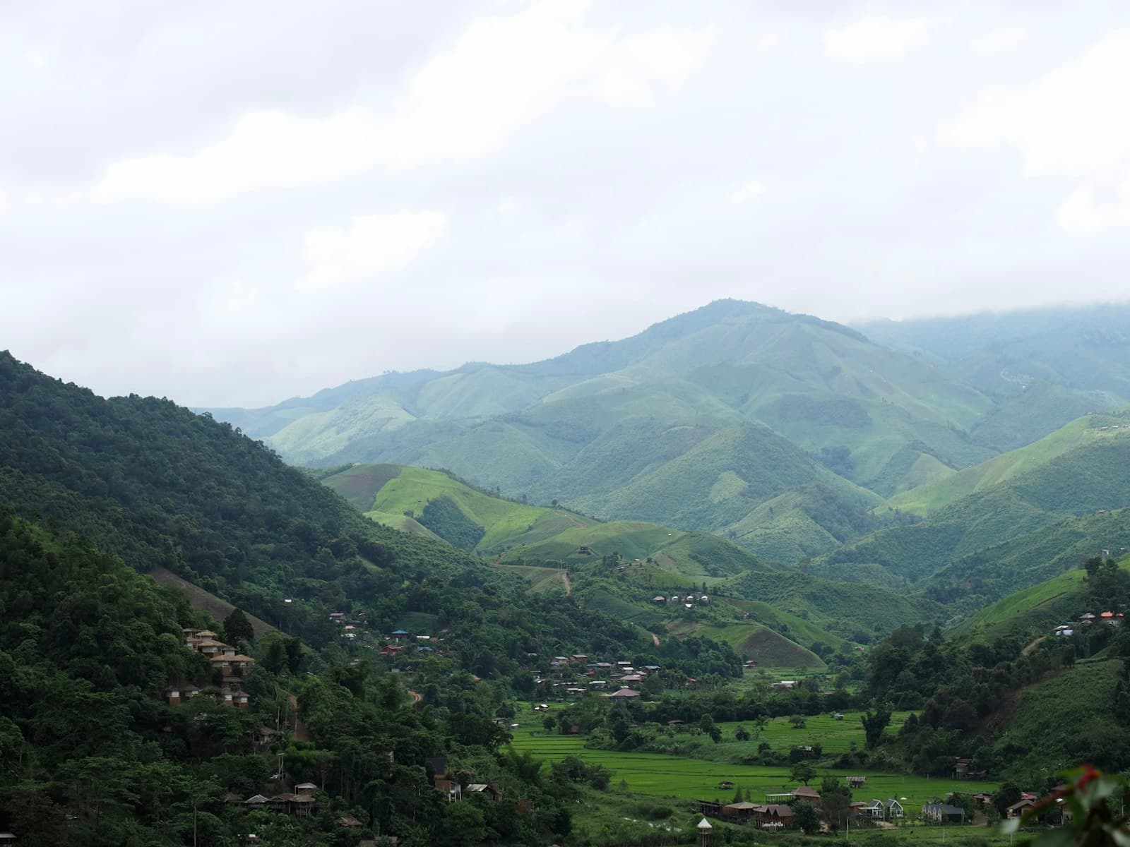 Nan — A valley with mountains in the background