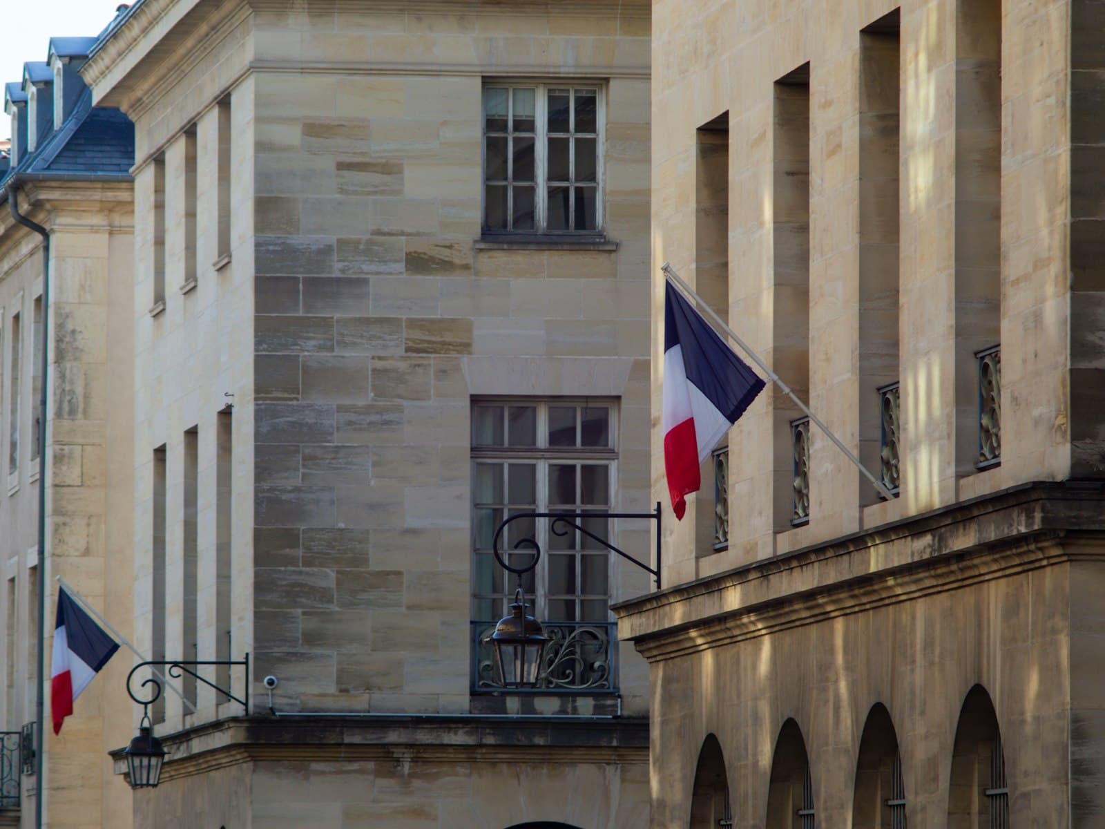 Nancy — a building with two flags flying in front of it