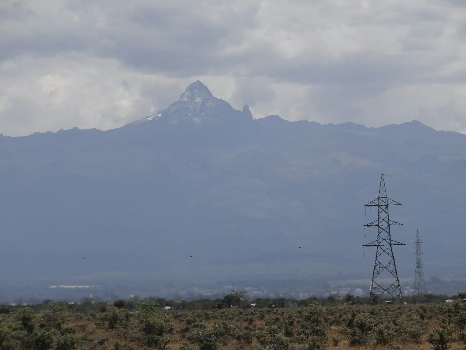 Nanyuki — A field with a mountain in the background
