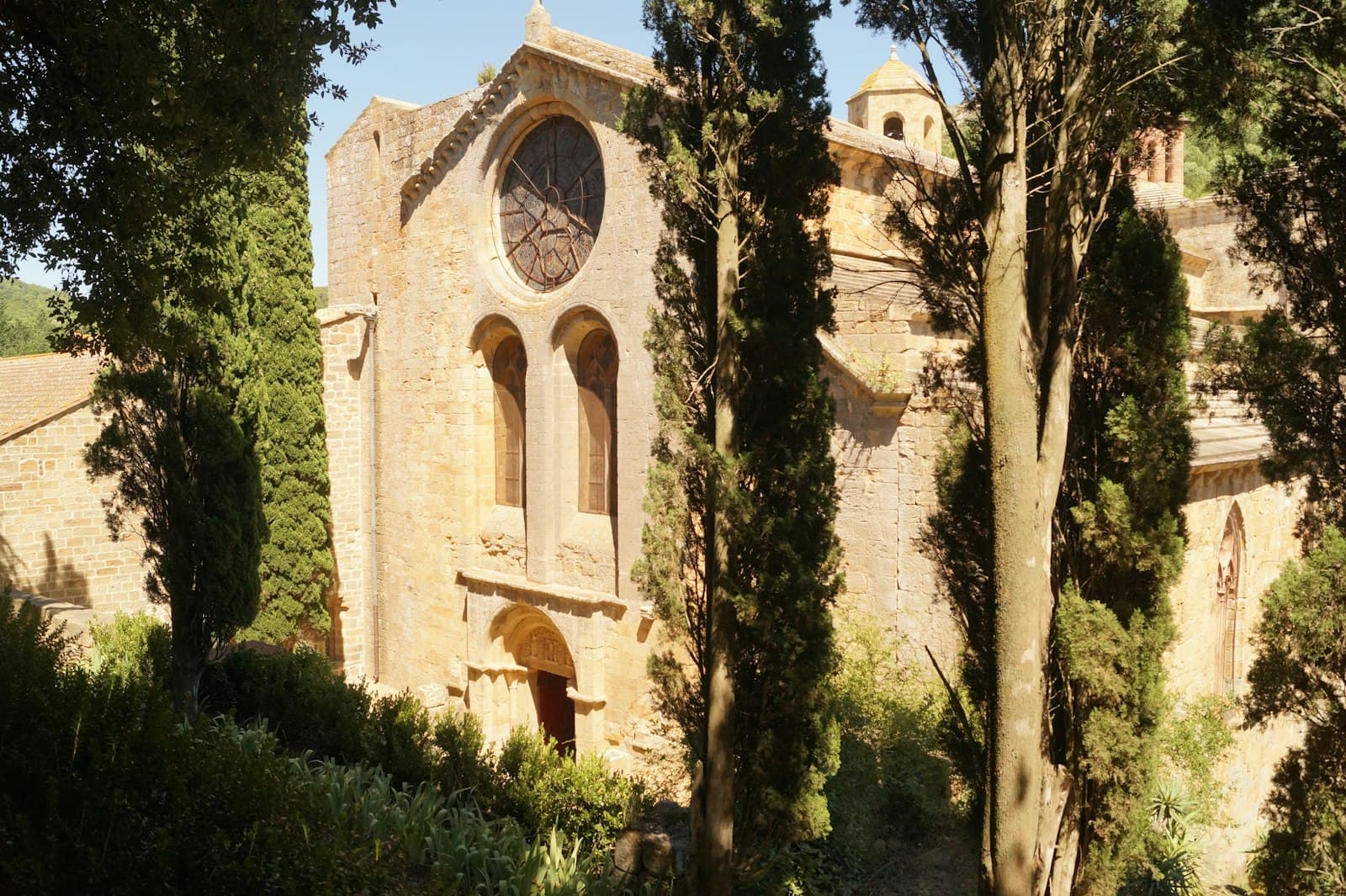 Narbonne — a stone building with a clock on the side of it