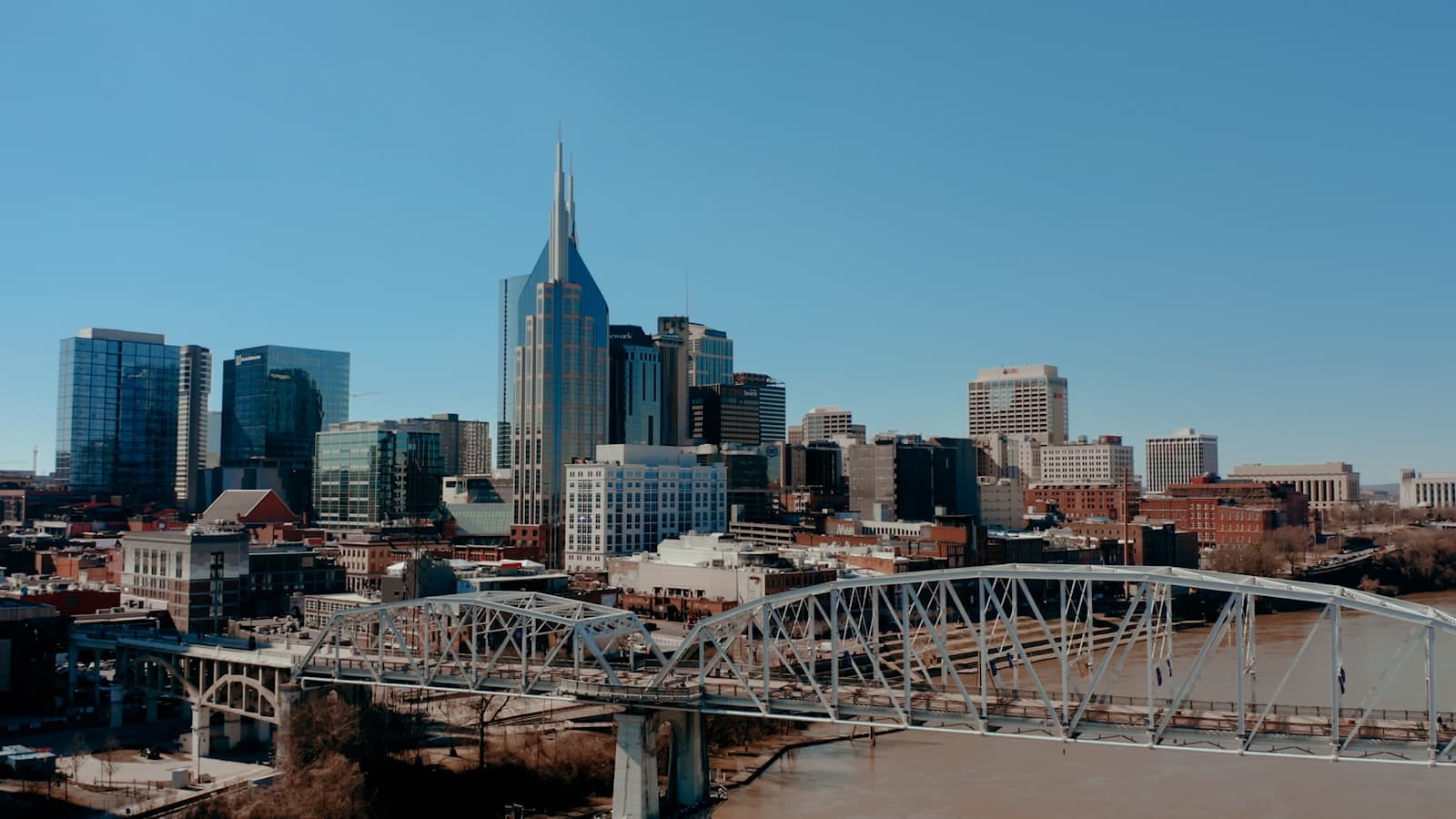 Nashville — a bridge over a river with a city in the background