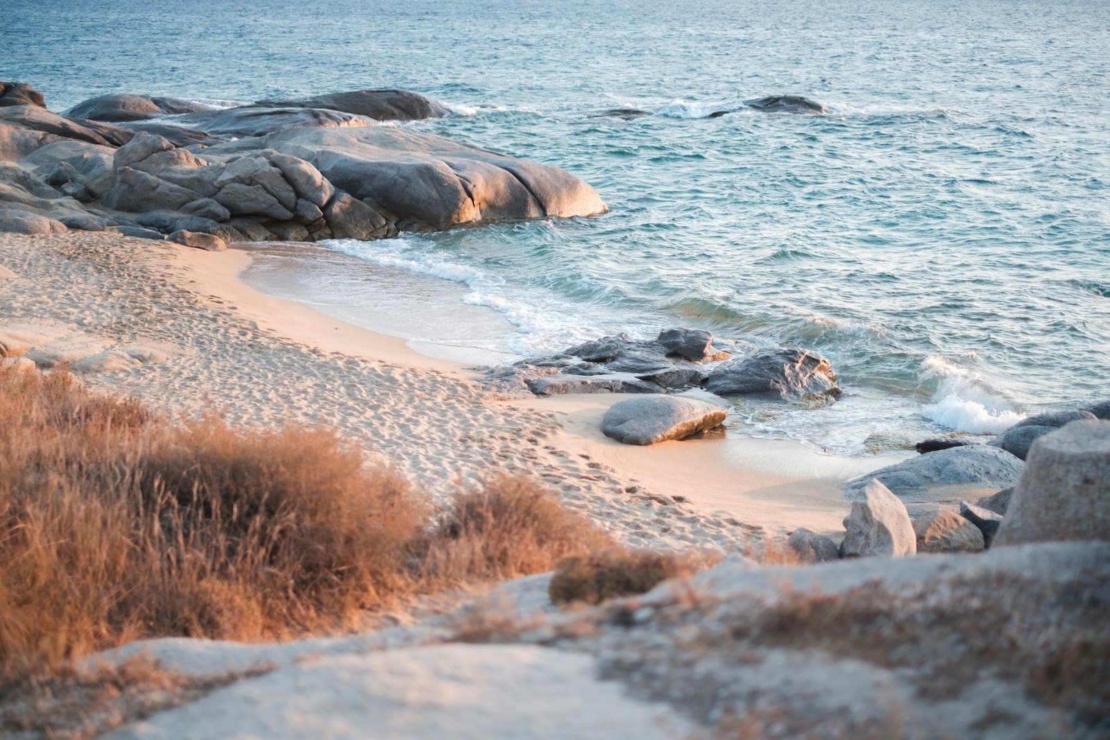 Naxos — rock formations near body of water during daytime