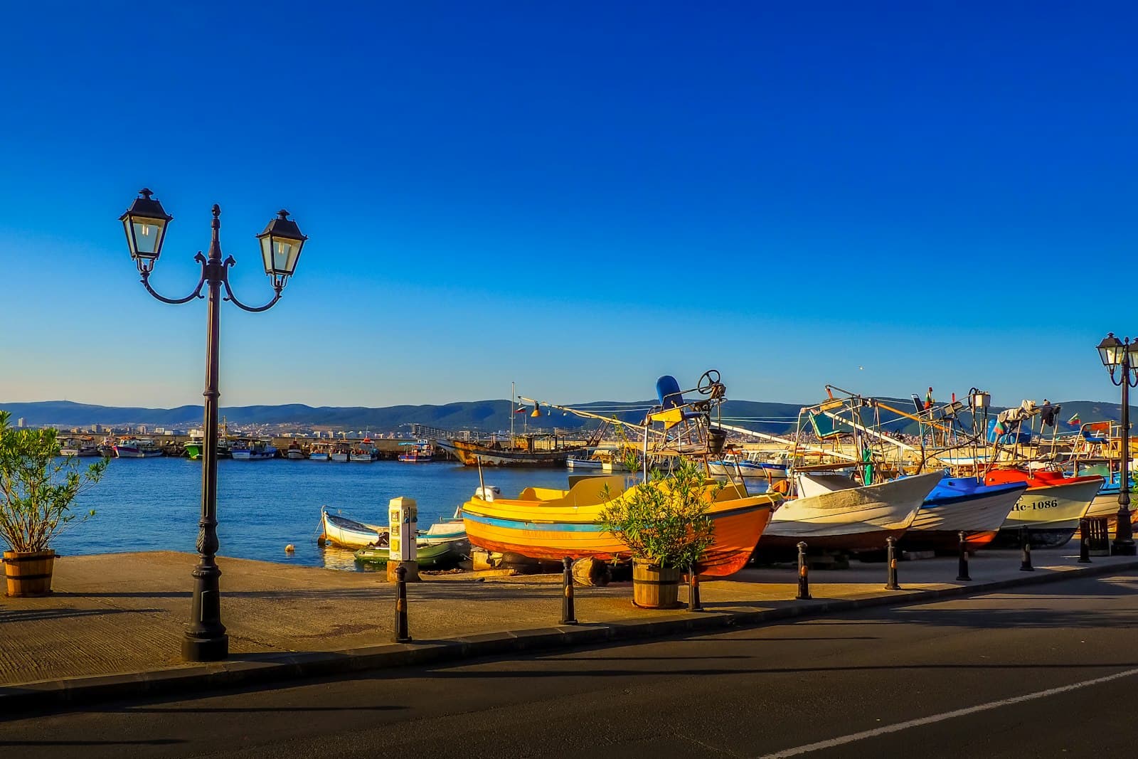Nessebar — a row of boats sitting on top of a pier