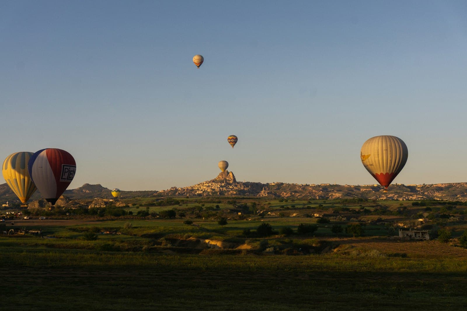 Nevşehir — a group of hot air balloons flying in the sky
