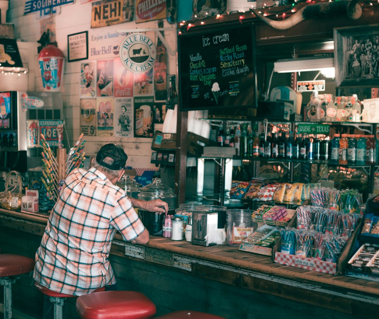 New Braunfels — man in white and black plaid dress shirt standing in front of counter