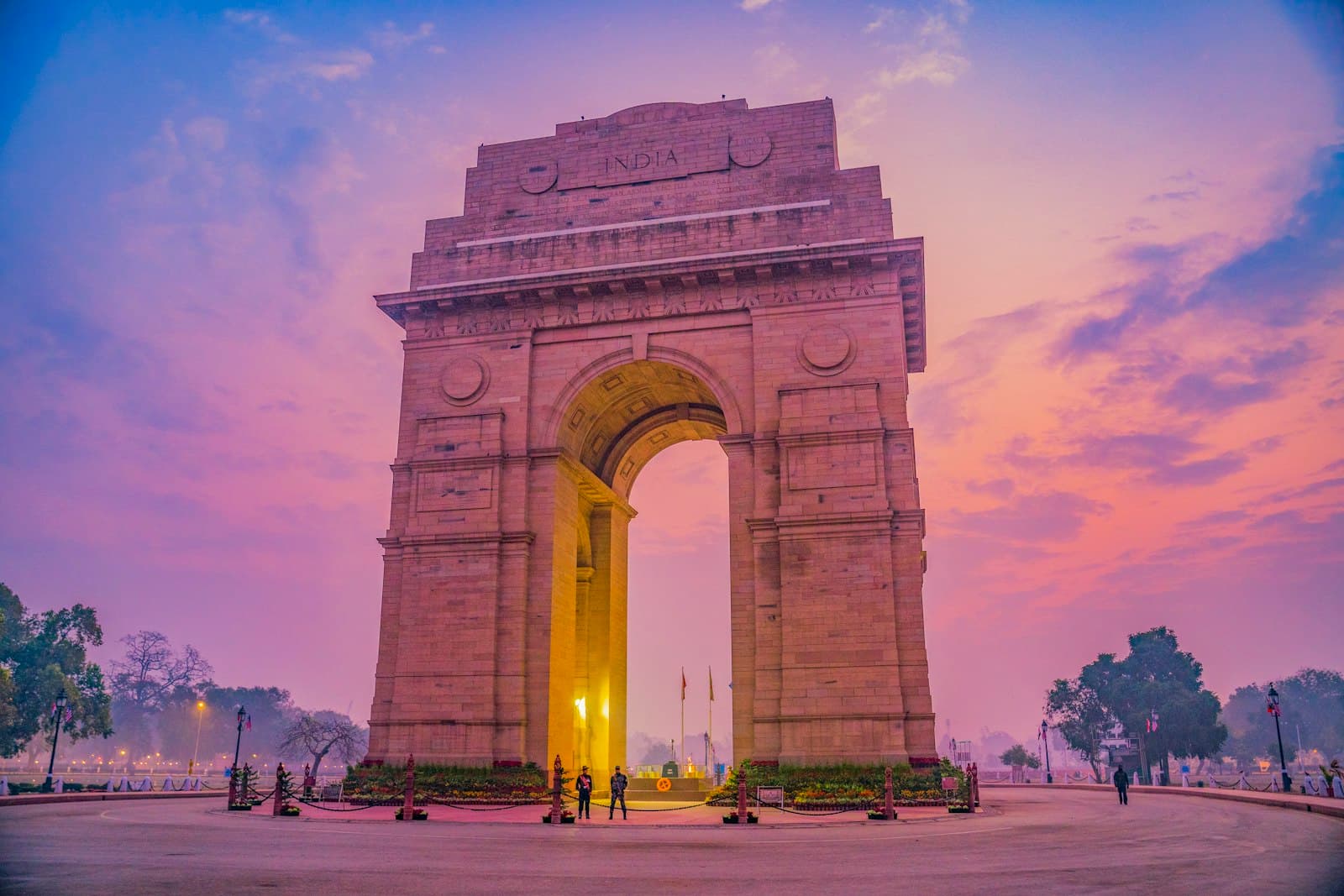New Delhi — brown concrete arch under blue sky during daytime