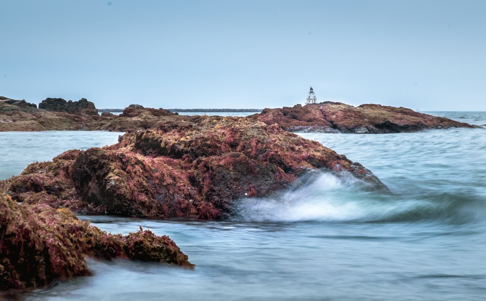 New Haven — brown rock formation on sea water during daytime