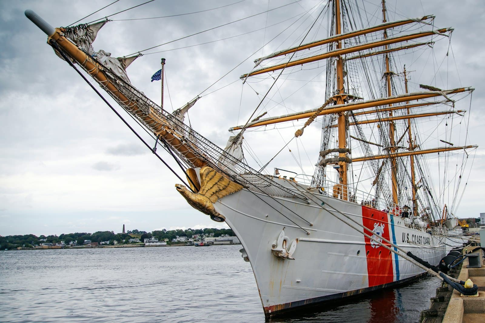 New London — a large white ship docked at a pier