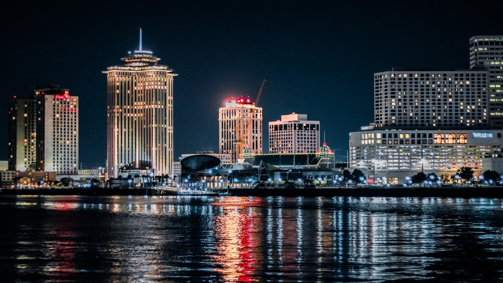 New Orleans — a view of a city at night from across the water