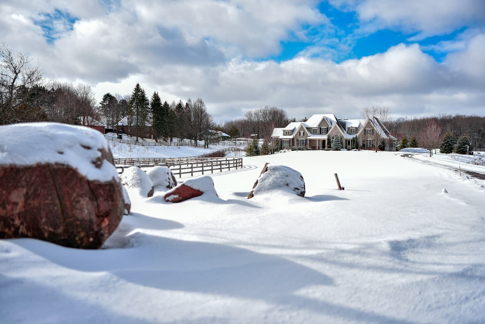Newmarket — a snow covered field with a house in the background