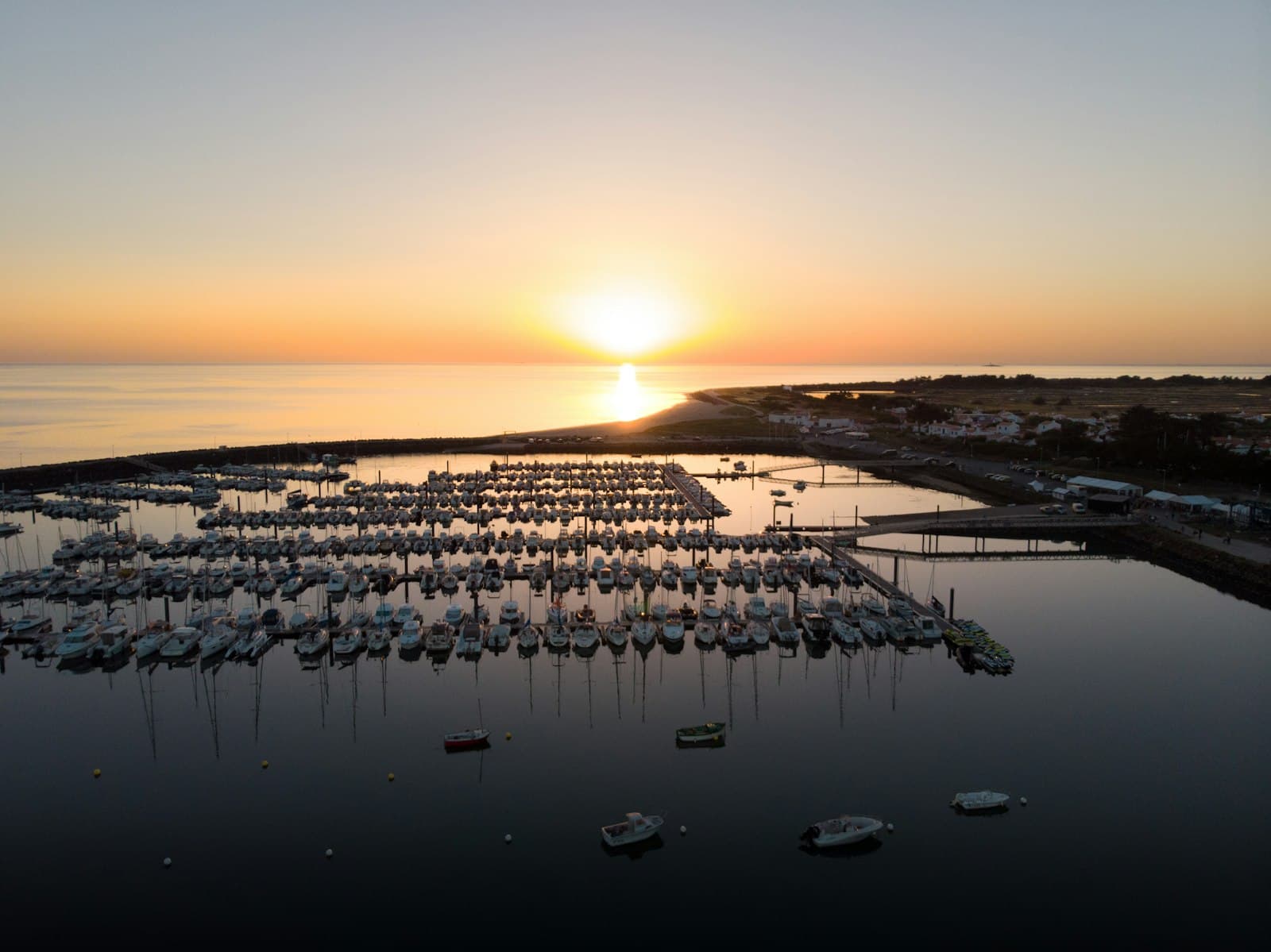 Noirmoutier-en-l'Île — white and black boats on sea during sunset