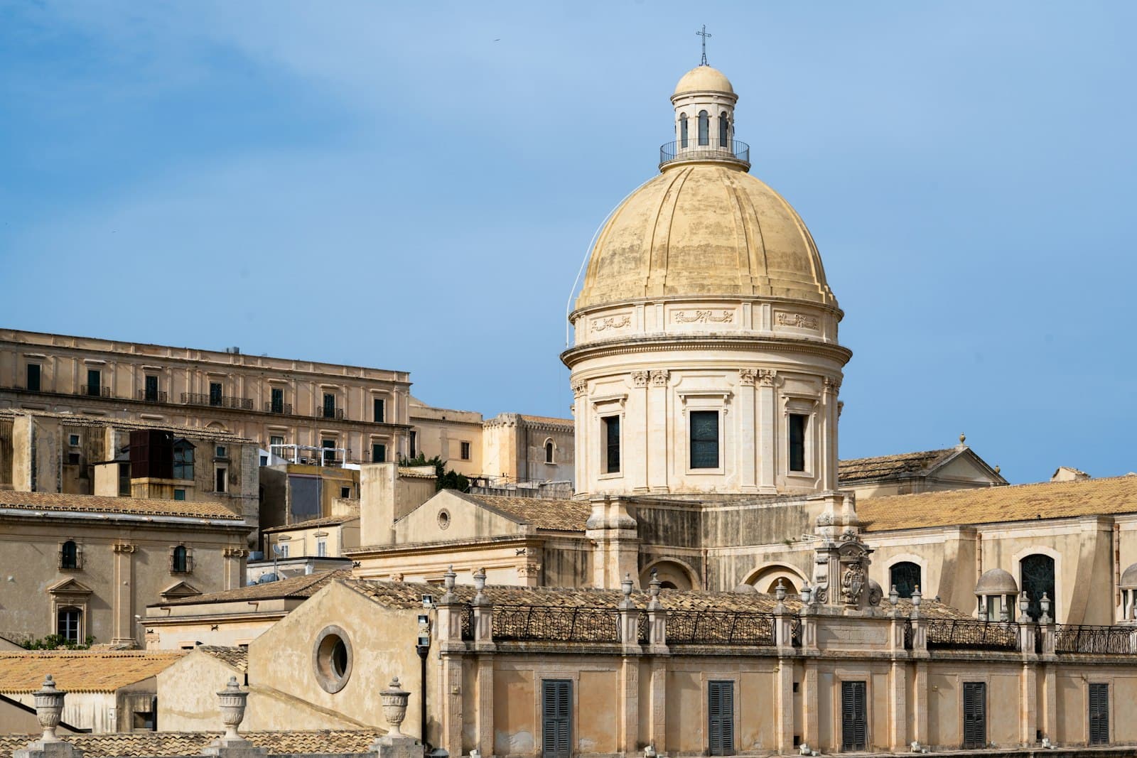 Noto — A grand dome cathedral against a clear blue sky