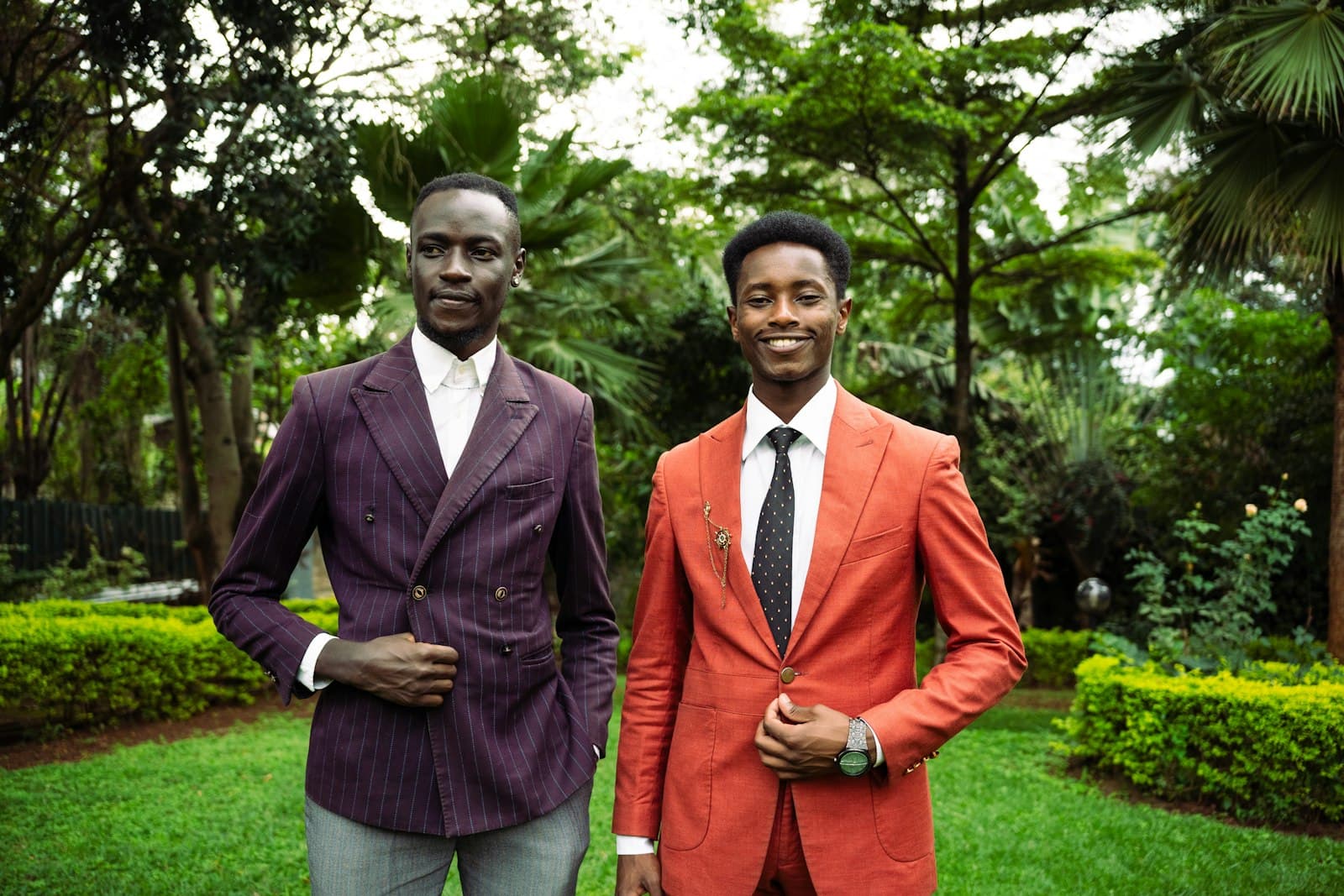 Nyeri — Two men in suits standing in a garden