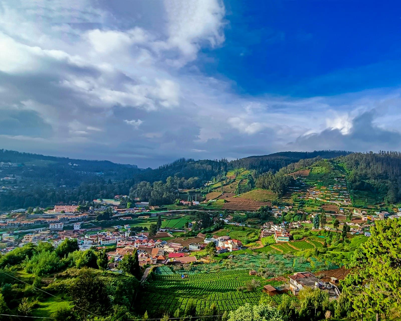 Ooty — a scenic view of a small town on a hill