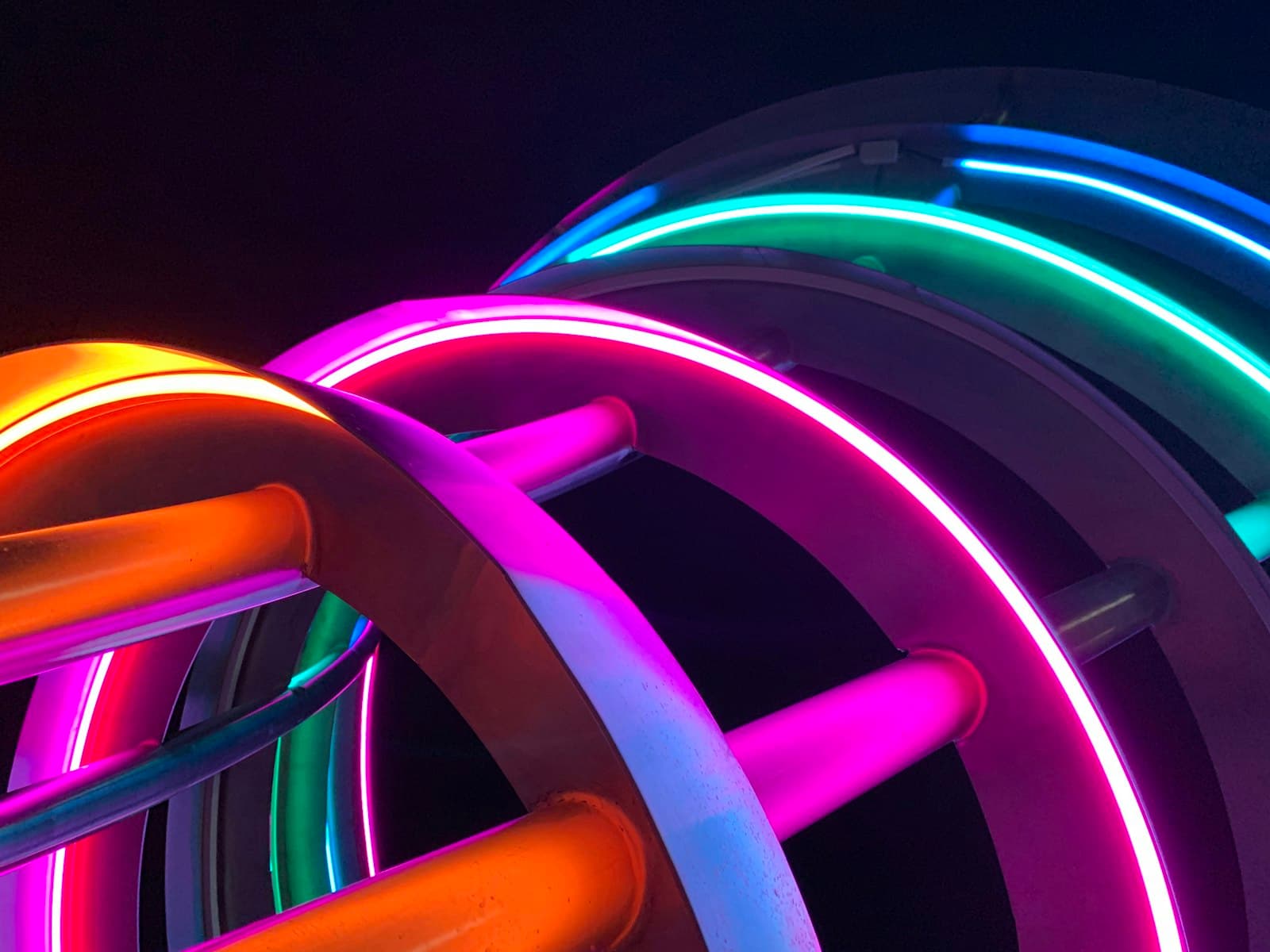 Opole — Glowing, colorful neon light circles and tubes.