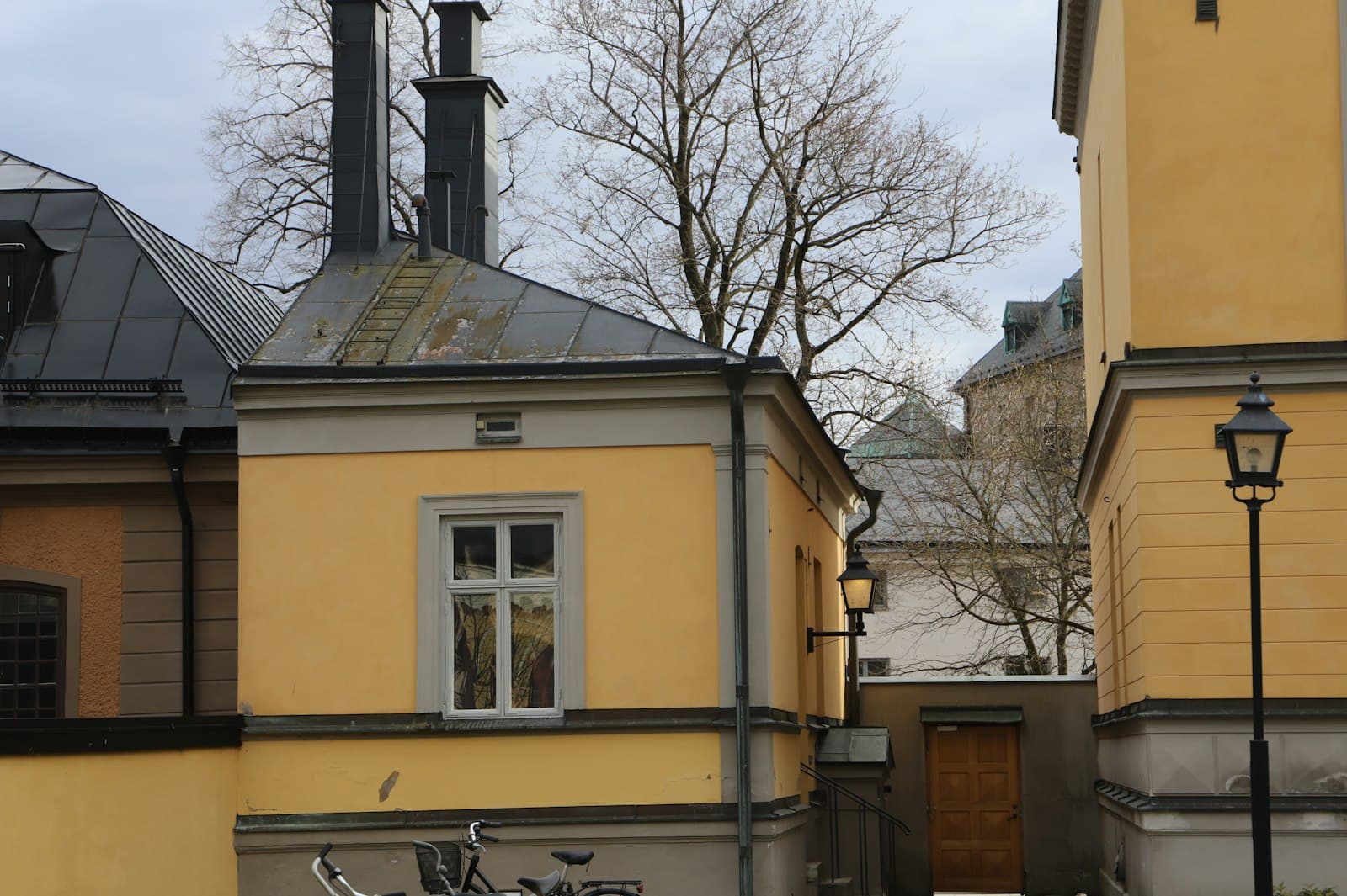 Örebro — a bicycle parked in front of a yellow building
