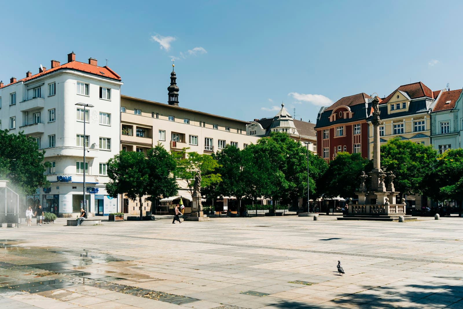 Ostrava — a city square with a fountain in the middle of it